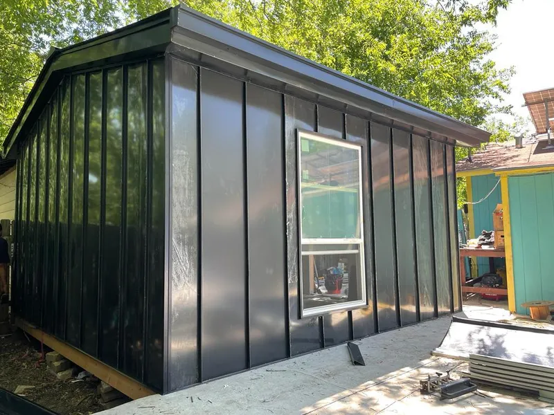 Black standing seam metal wall panels for Roof Inspection in East Rochester